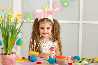 Portrait of girl playing with toys on table