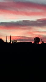 Silhouette trees against sky during sunset