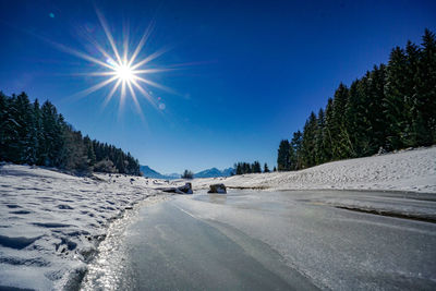 Scenic view of snowcapped mountains against clear sky