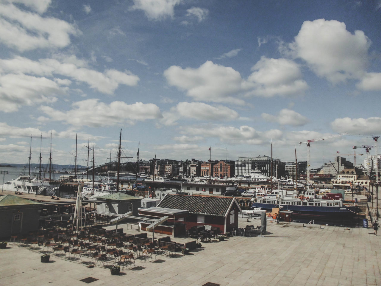 HIGH ANGLE VIEW OF SAILBOATS MOORED AT HARBOR