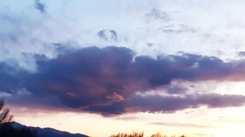 Low angle view of cloudy sky during sunset