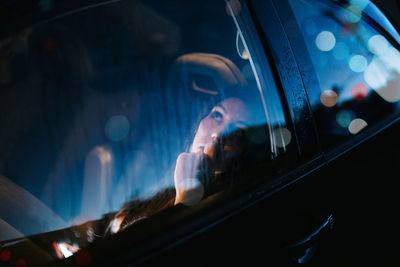 Beautiful woman sitting in car