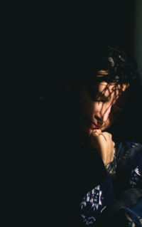 Portrait of man sleeping on bed