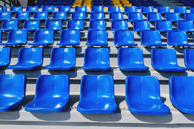 Row of empty chairs at stadium