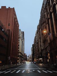 City street amidst buildings against sky