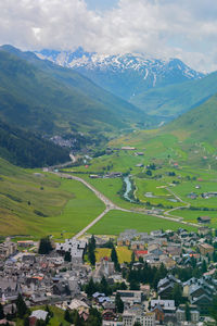 Aerial view of landscape and buildings against sky