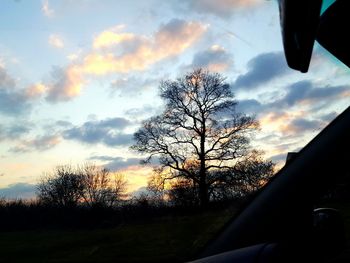 Scenic view of landscape against cloudy sky