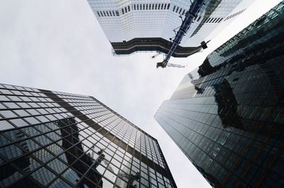 Directly below shot of modern buildings against sky