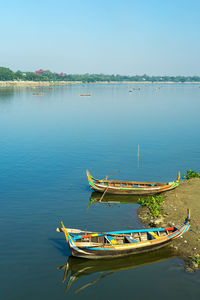 Lake with traditional  boat u-bein bridge myanmar