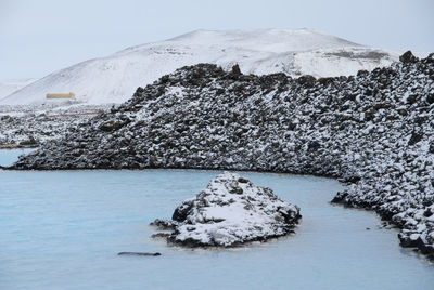 Scenic view of landscape against sky during winter