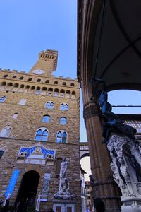 Low angle view of historical building against blue sky