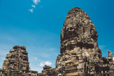 Low angle view of old temple building against sky