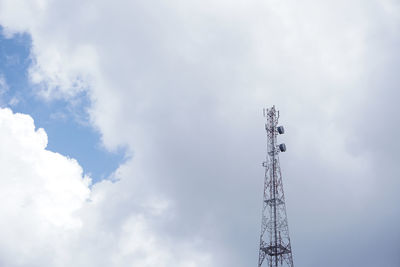 Low angle view of communications tower against sky