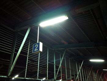 Low angle view of illuminated street light at night