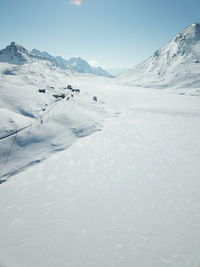 Scenic view of snow covered mountains against sky