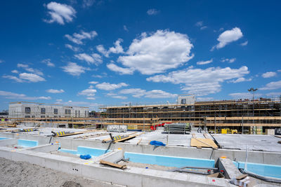 High angle view of buildings against blue sky