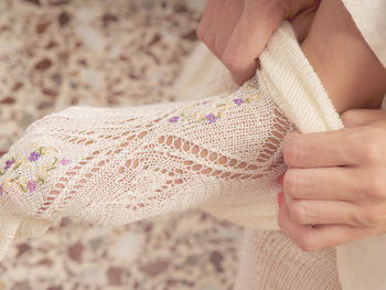 Midsection of woman holding fabric