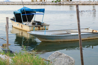 Boat moored in lake