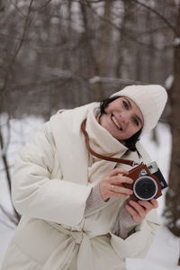 Young woman photographing through camera