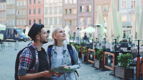 Young couple standing in city