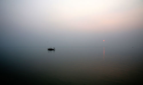 A stunning sunset looking over the holiest of rivers in india. ganges delta in sundarbans, india