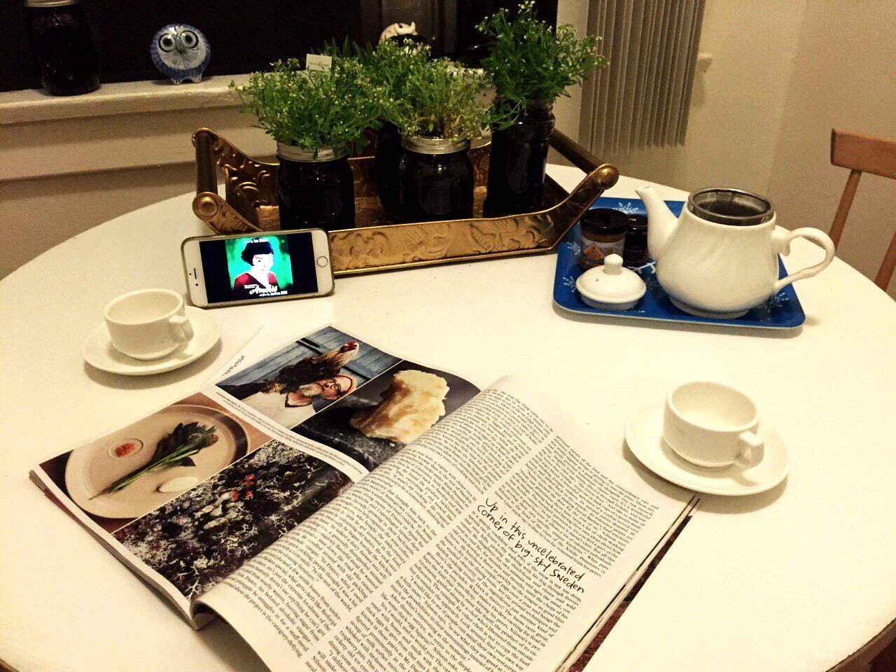 indoors, technology, table, communication, wireless technology, laptop, high angle view, computer, book, connection, coffee cup, photography themes, mobile phone, desk, computer keyboard, coffee - drink, still life, chair