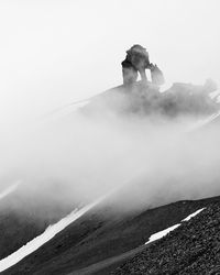 Scenic view of mountains against sky during winter