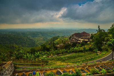Scenic view of landscape against cloudy sky