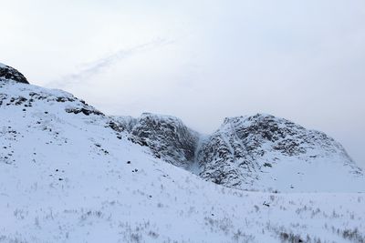 Snow covered mountain against sky