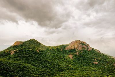 Scenic view of mountains against cloudy sky