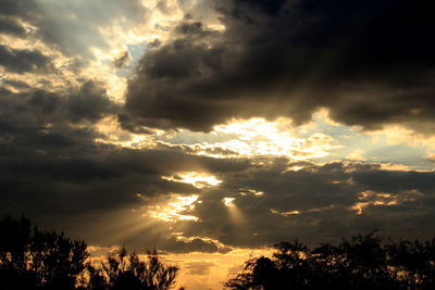 Low angle view of dramatic sky during sunset