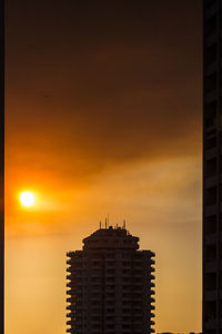 High section of building against cloudy sky