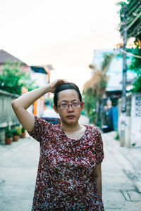 Portrait of beautiful young woman in city