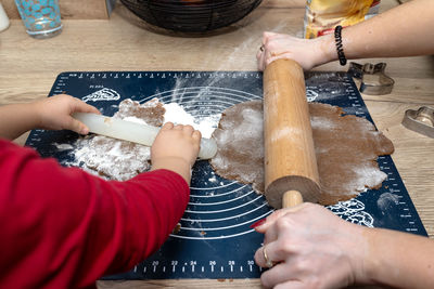 Cropped hands of person preparing food