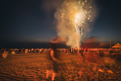 Firework display at night