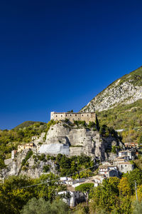 Low angle view of historical building against blue sky