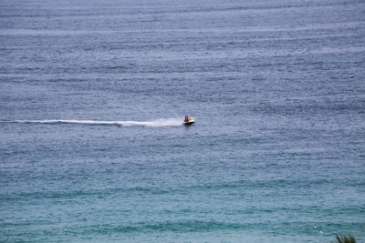 Man on boat in sea