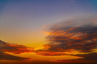 Low angle view of dramatic sky during sunset