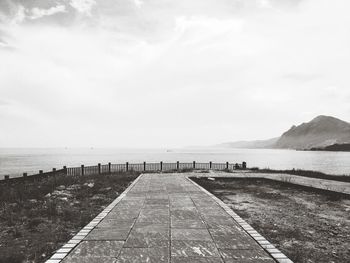 Pier over sea against sky