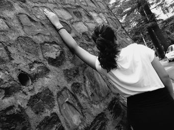 High angle view of woman walking on rocks