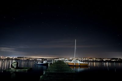 Scenic view of sea against sky at night