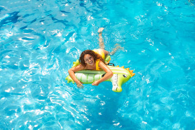 High angle view of woman swimming in pool