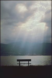 Scenic view of mountains against cloudy sky