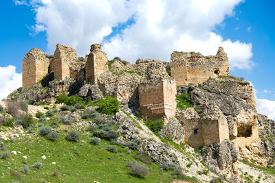 Low angle view of old ruin building against sky