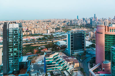 High angle view of buildings in city against clear sky