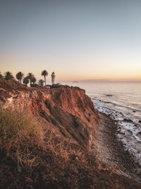 Scenic view of beach against sky during sunset