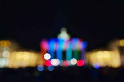 Defocused image of illuminated lights at night