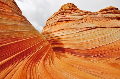 Close-up of rock formation against sky