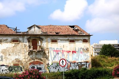 View of old building against cloudy sky
