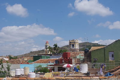 Buildings in town against sky